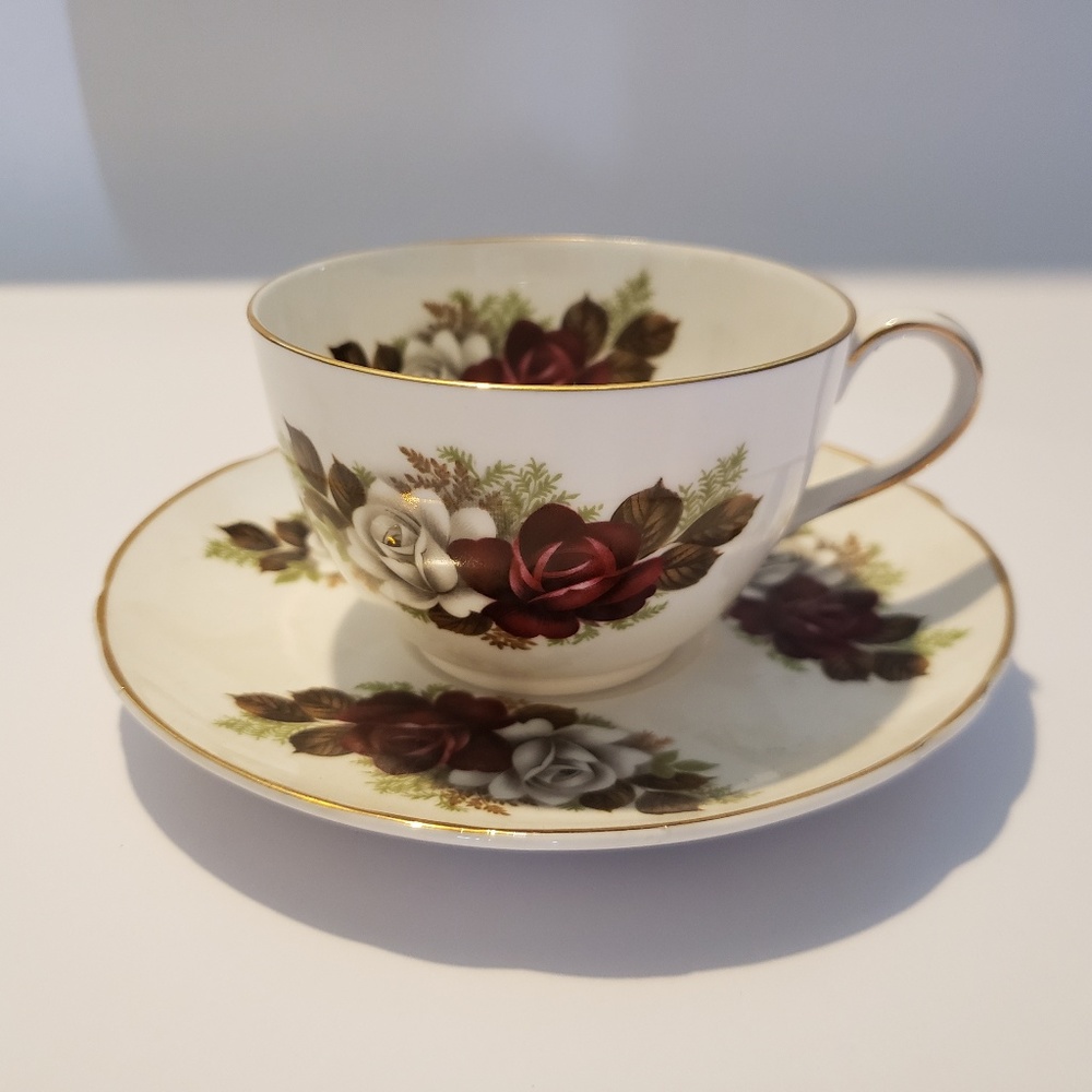 Peacock china Red and white rose cup saucer